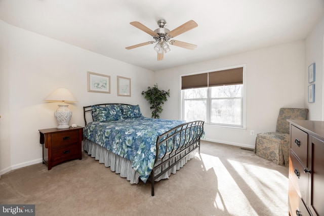 bedroom featuring ceiling fan and light colored carpet