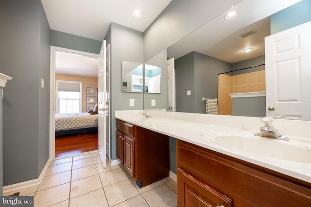 bathroom featuring tile patterned flooring and vanity