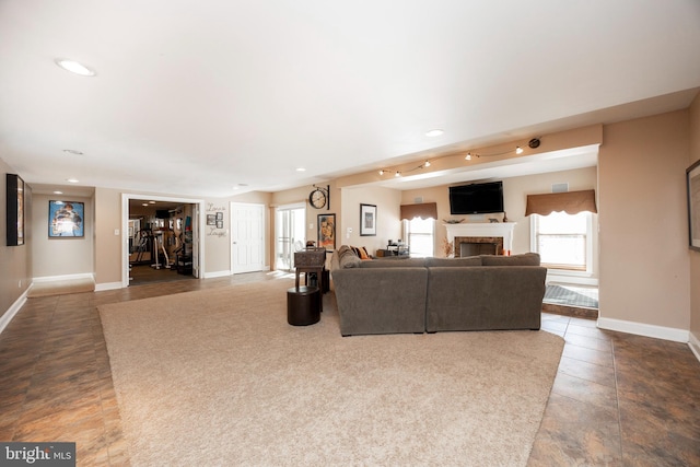 unfurnished living room featuring dark tile patterned flooring