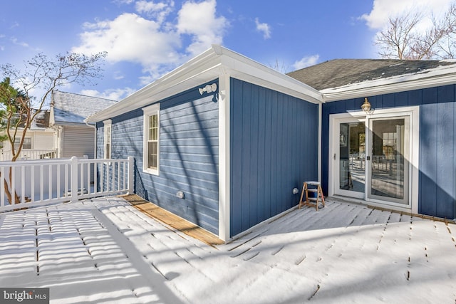 view of exterior entry with a deck