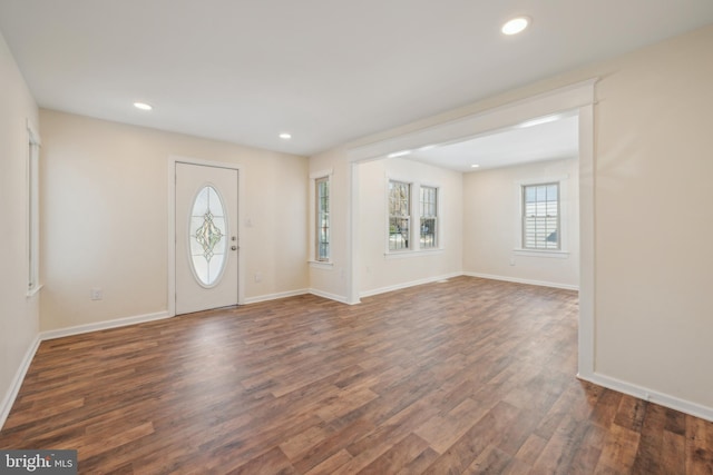 entryway with dark hardwood / wood-style floors