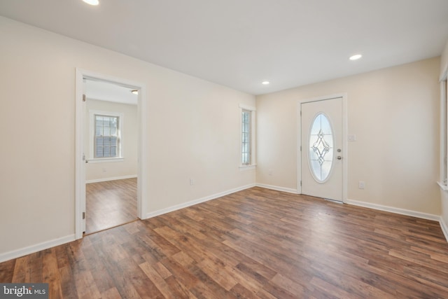 entrance foyer with dark hardwood / wood-style floors