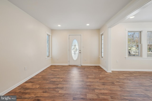 foyer with dark hardwood / wood-style flooring