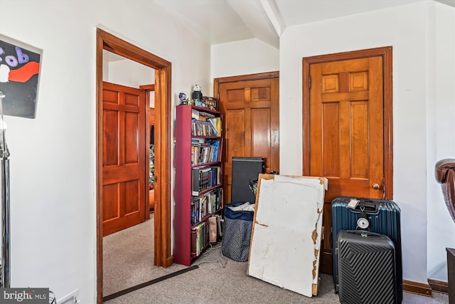 interior space featuring light colored carpet