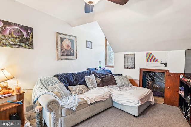 living room featuring carpet flooring, vaulted ceiling, and ceiling fan