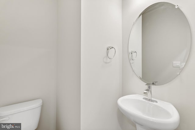 bathroom with toilet and sink