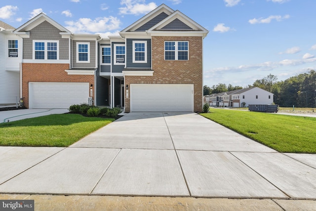 view of front facade with a front yard and a garage