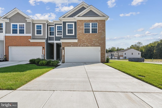 view of front of house featuring a front yard and a garage