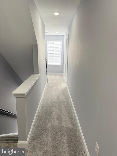 corridor featuring carpet flooring