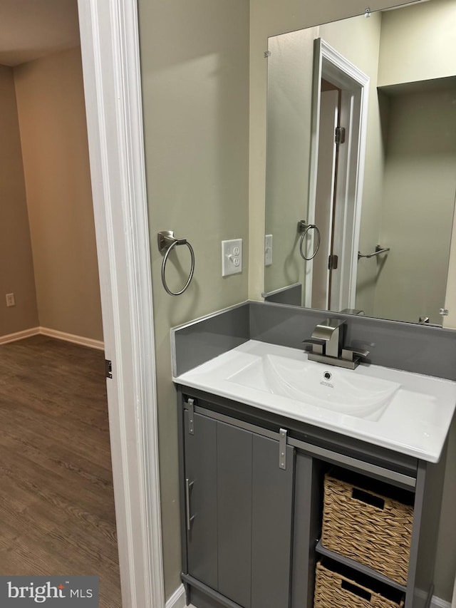 bathroom featuring vanity and hardwood / wood-style flooring