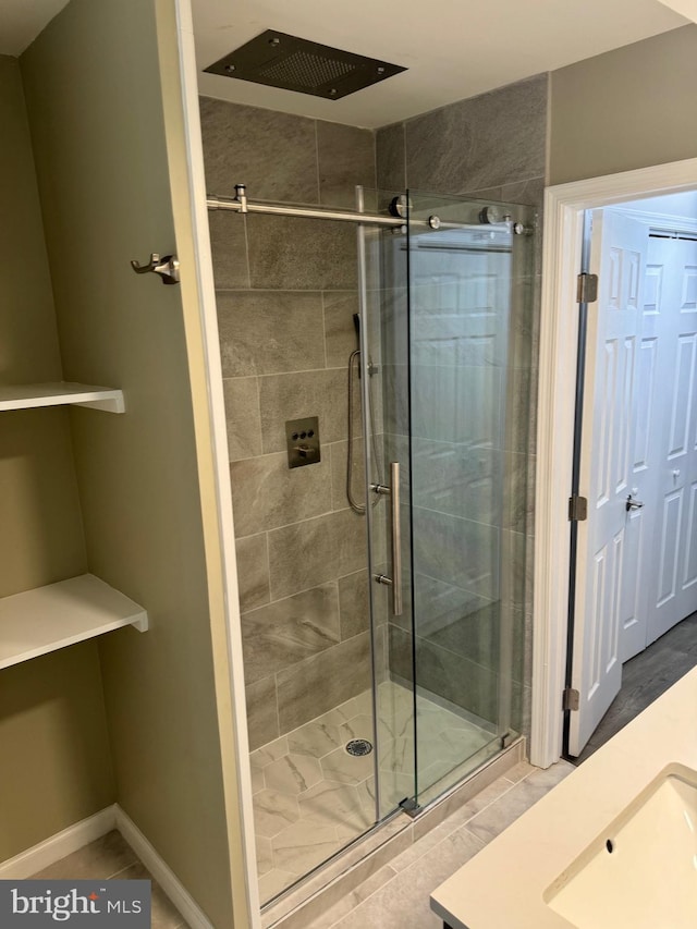 bathroom with sink, tile patterned floors, and a shower with shower door