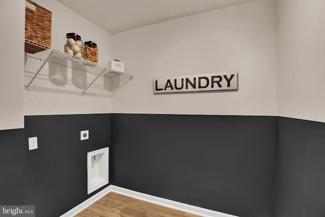 washroom featuring hookup for an electric dryer and wood-type flooring