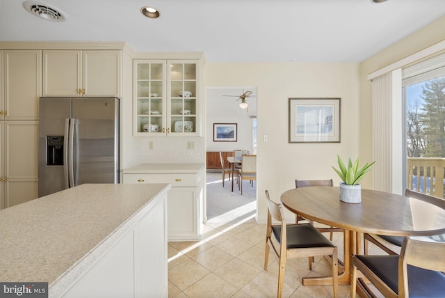 dining space with light tile patterned floors