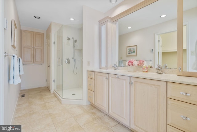 bathroom featuring vanity, decorative columns, and walk in shower