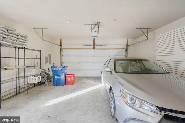 garage featuring a garage door opener and electric panel