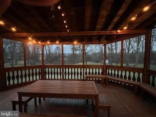 sunroom / solarium with beamed ceiling