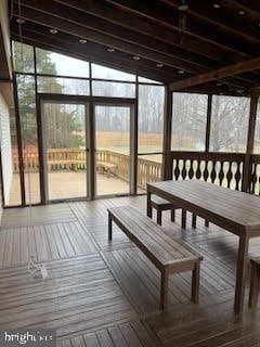 unfurnished sunroom featuring a wealth of natural light