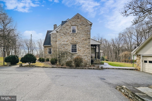 view of property exterior featuring a garage