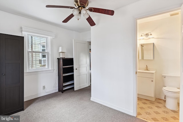 carpeted bedroom featuring ceiling fan, sink, and connected bathroom