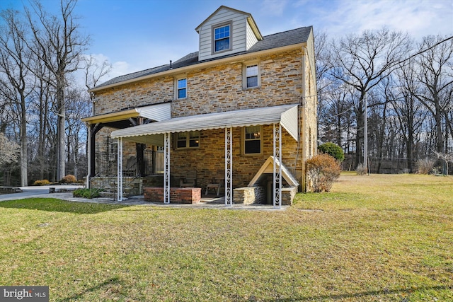 back of house with a yard