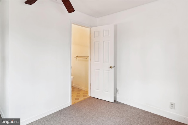 unfurnished room with carpet floors and ceiling fan