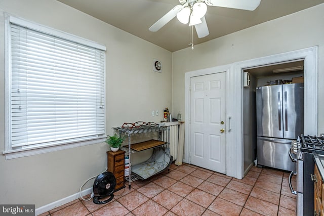 interior space with ceiling fan