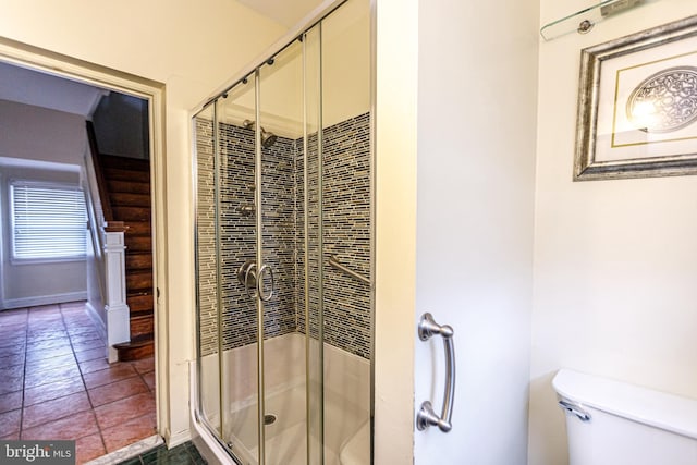 bathroom with walk in shower and toilet