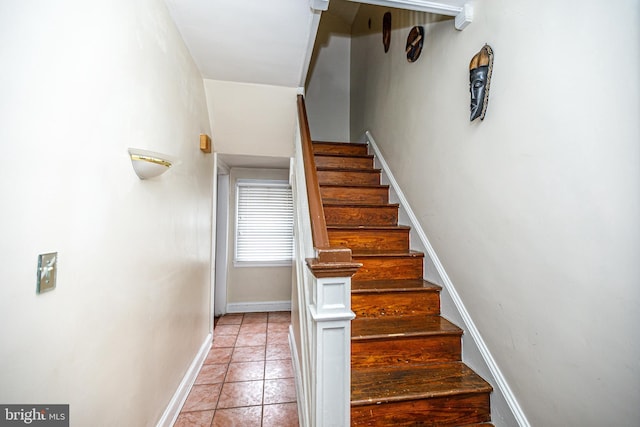 stairs with tile patterned floors