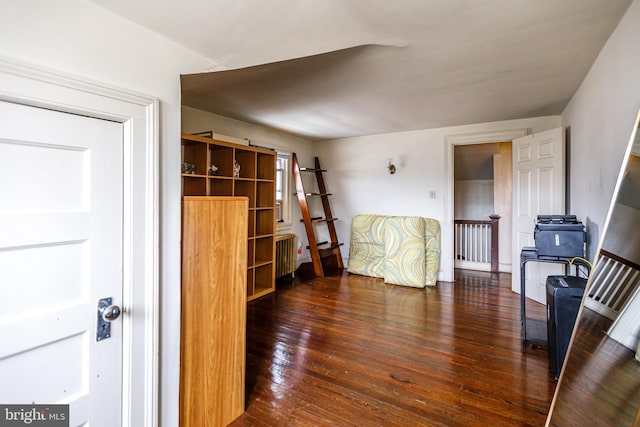 interior space with radiator and dark wood-type flooring