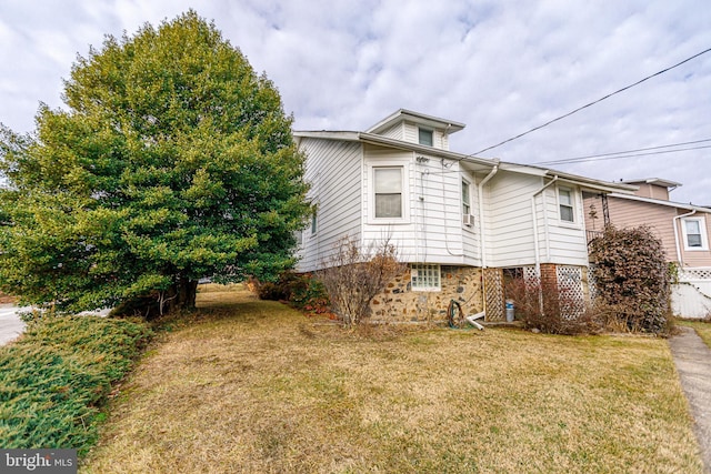 view of property exterior with a yard