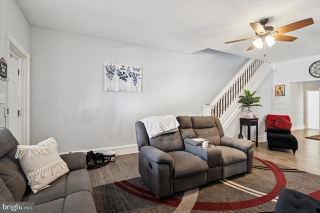 living room with ceiling fan and hardwood / wood-style flooring