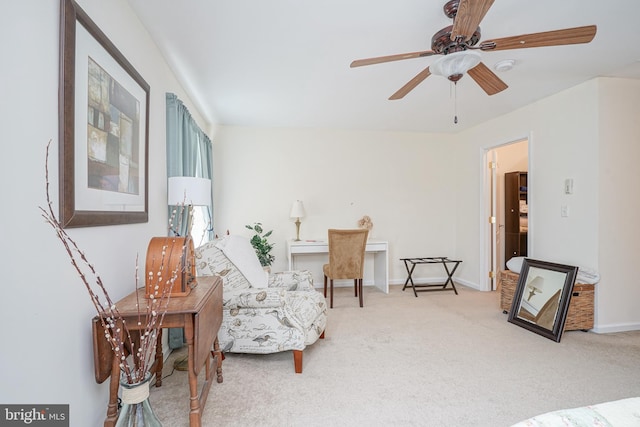 sitting room with light carpet and ceiling fan