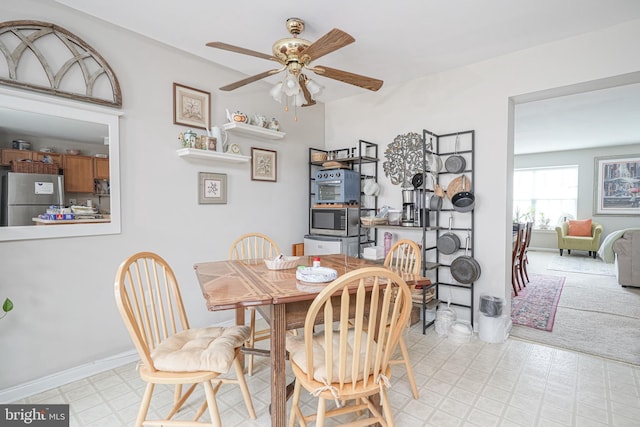 dining space featuring ceiling fan