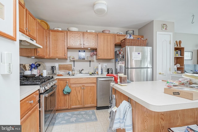 kitchen featuring a breakfast bar, stainless steel appliances, and sink