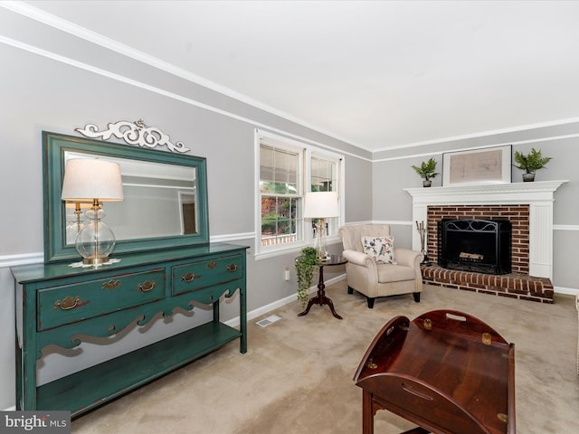 living area with crown molding, light colored carpet, and a brick fireplace