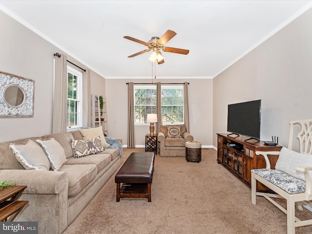 living room featuring ceiling fan, light carpet, and ornamental molding