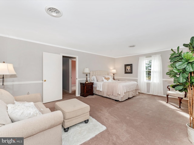 bedroom with carpet flooring and crown molding