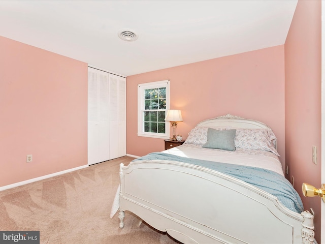 carpeted bedroom featuring a closet