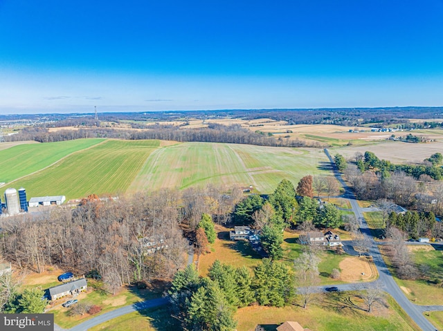 birds eye view of property with a rural view