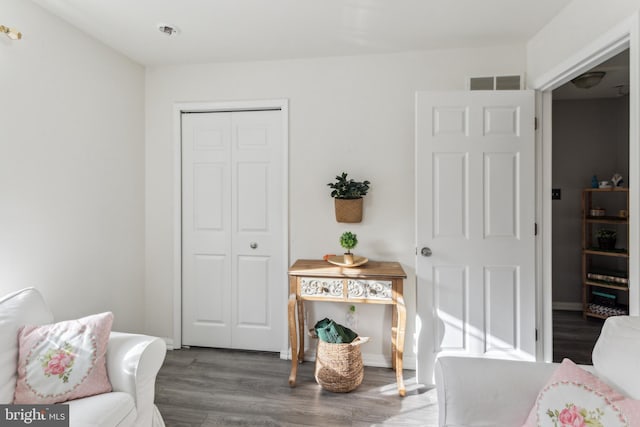 sitting room with hardwood / wood-style floors