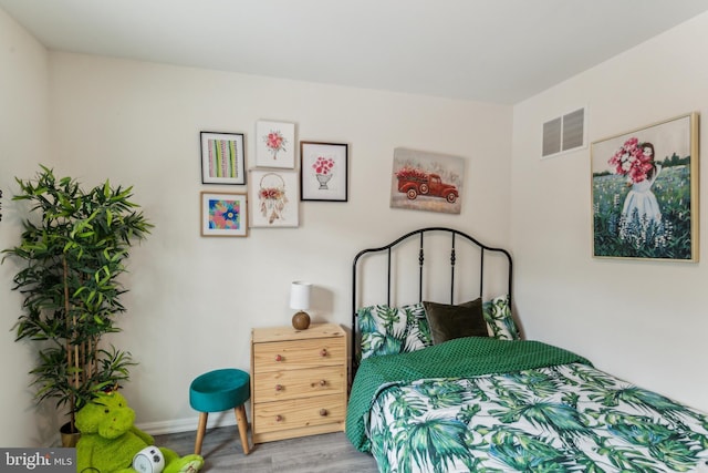 bedroom featuring wood-type flooring