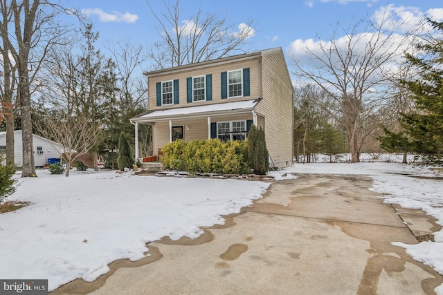 view of front property featuring covered porch