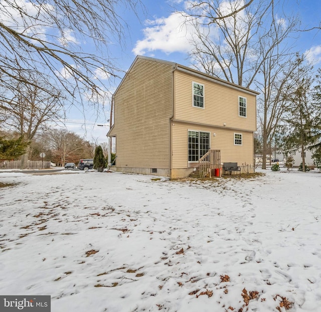 view of snow covered house