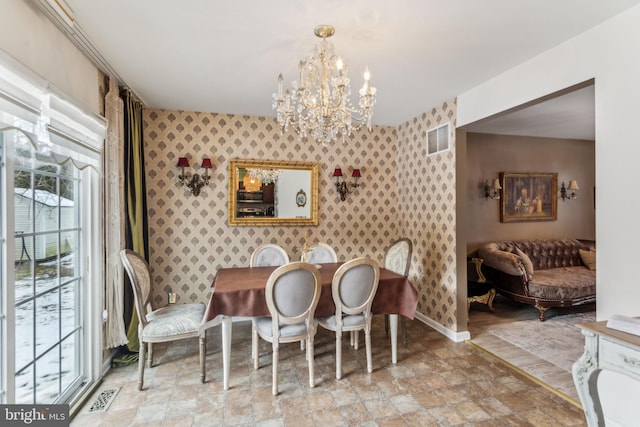 dining space with a chandelier