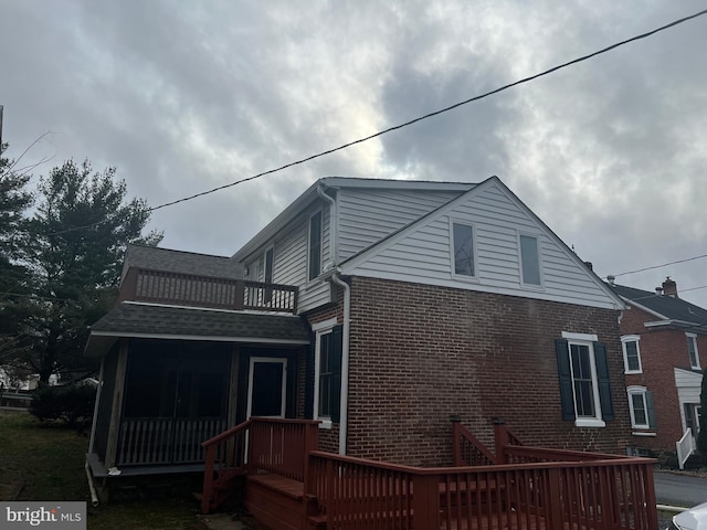 rear view of house with a balcony