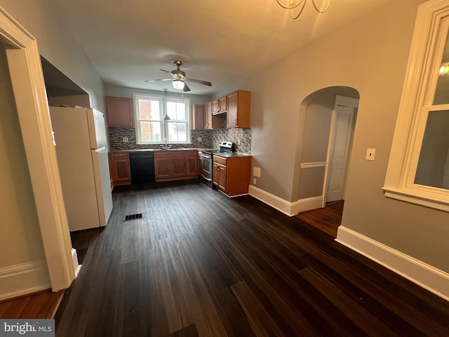 kitchen with white refrigerator, decorative backsplash, ceiling fan, stainless steel electric range oven, and black dishwasher