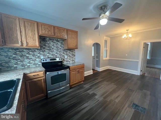 kitchen featuring decorative backsplash, ceiling fan with notable chandelier, dark wood-type flooring, sink, and electric stove