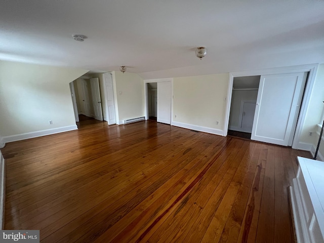 interior space featuring dark hardwood / wood-style flooring and baseboard heating