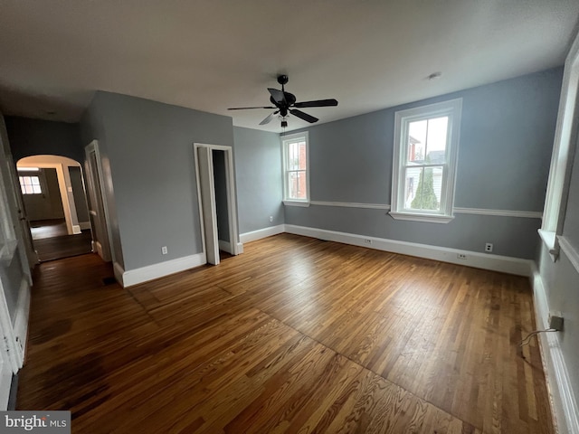 unfurnished bedroom with hardwood / wood-style floors and ceiling fan