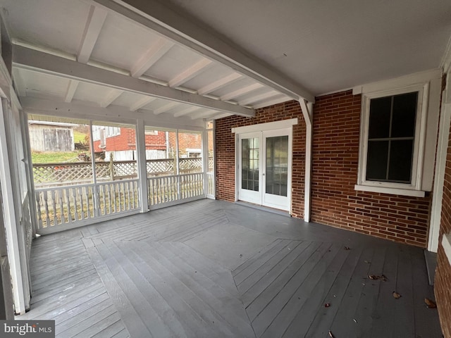 wooden deck featuring french doors